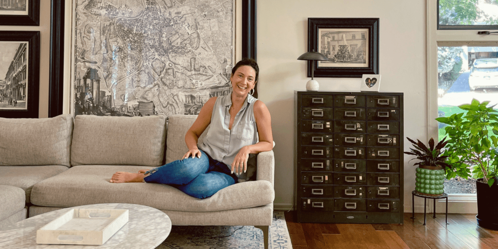Wide shot Libby Bryant of Libby Co sitting on sofa